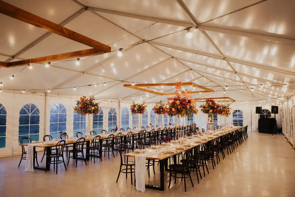 Groom and bride are knocking glasses of champagne