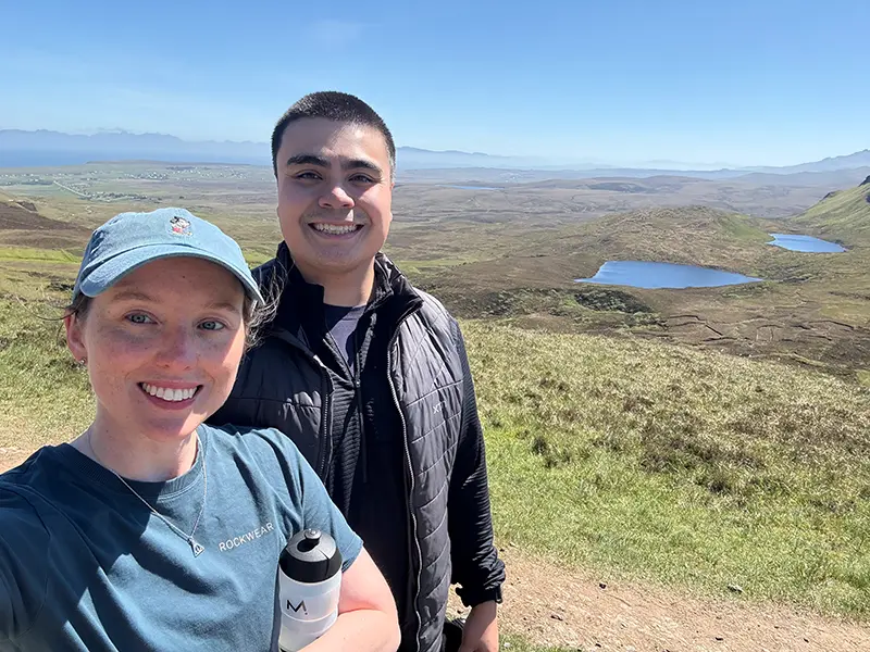 Bride and groom having their wedding with guests on the beach